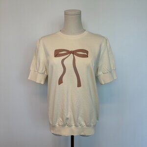 Cream Short Sleeve Knit Tee with Bow Graphic